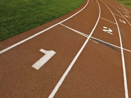 Staggered lane numbers on rubberized surface of all-weather running track