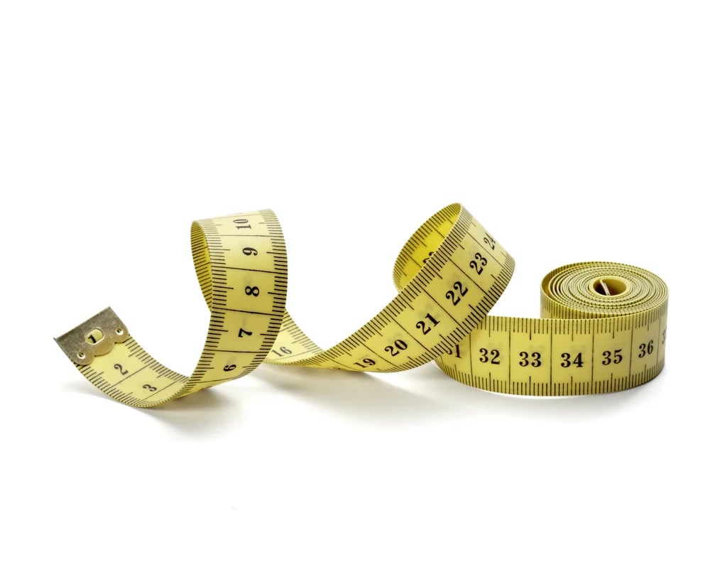 close up of measure tape on white background with clipping path.jpeg
