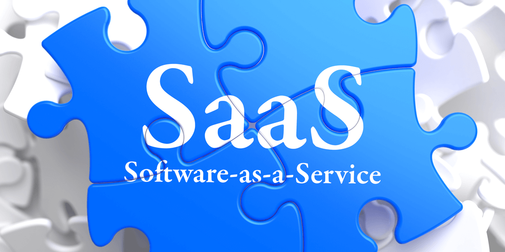 SAAS - Software-as-a-Service - Written on Blue Puzzle Pieces 1000x500